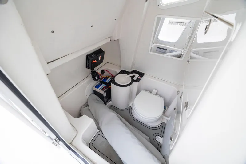 Slide: The Image of 2023 Sea Fox 268 Commander boat interior with toilet and storage area. - 14