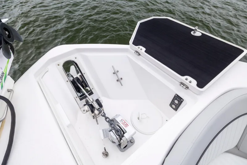 Slide: The Image of 2023 Sea Fox 268 Commander boat anchor compartment with winch and storage. - 18