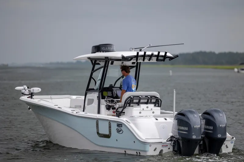 Slide: The Image of 2023 Sea Fox 268 Commander boat with dual Yamaha engines on the water. - 2