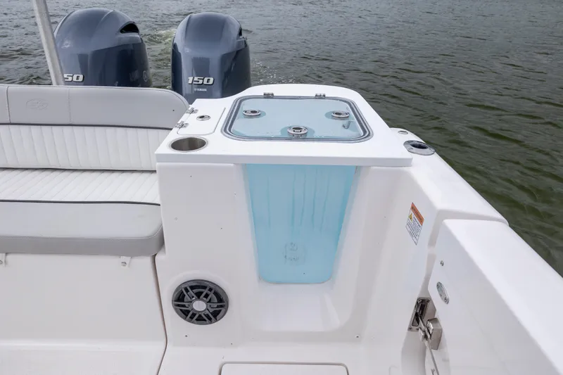 Slide: The Image of 2023 Sea Fox 268 Commander boat with twin Yamaha 150 engines, featuring a livewell and seating. - 26