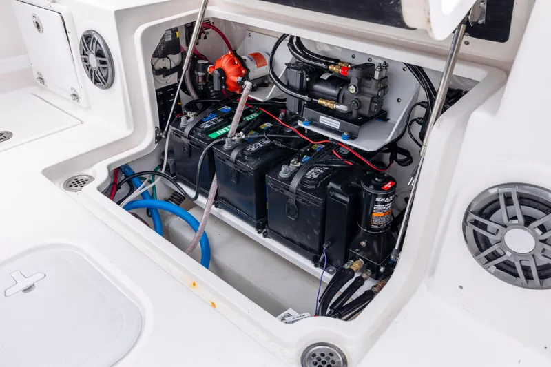 Slide: The Image of 2023 Sea Fox 268 Commander battery compartment with wiring and components. - 28