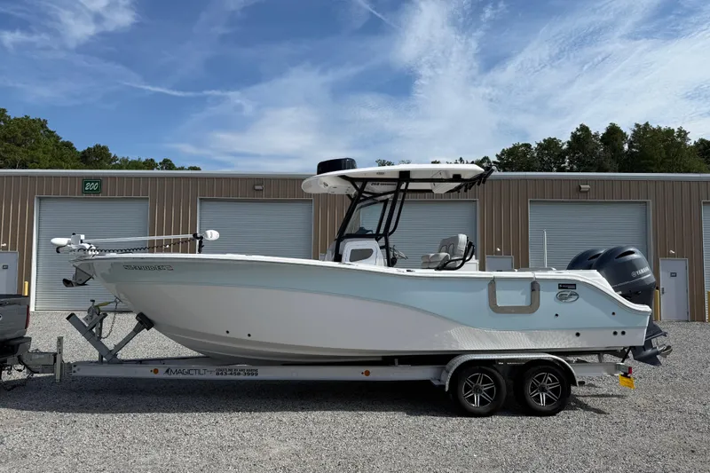 Slide: The Image of 2023 Sea Fox 268 Commander boat on trailer, parked in front of storage units. - 30