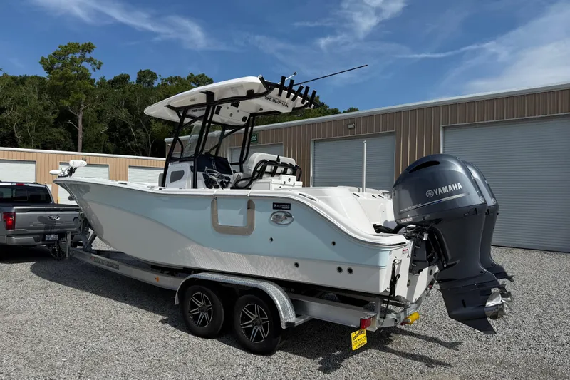 Slide: The Image of 2023 Sea Fox 268 Commander boat on trailer with Yamaha engine, parked outdoors. - 31