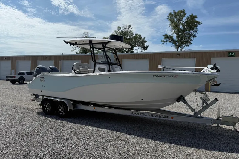 Slide: The Image of 2023 Sea Fox 268 Commander boat on trailer, parked outdoors under a clear sky. - 37