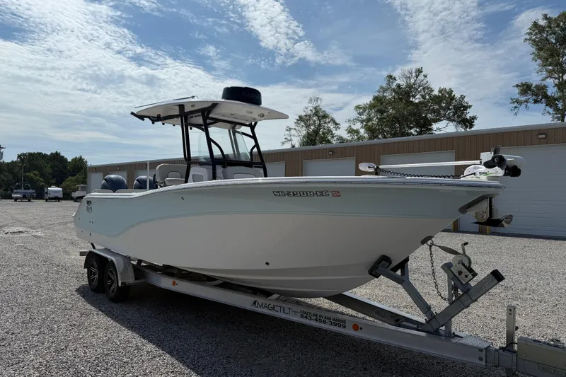 Slide: The Image of 2023 Sea Fox 268 Commander boat on trailer, parked outdoors under a partly cloudy sky. - 38