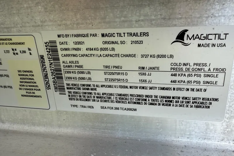 Slide: The Image of Magic Tilt trailer label for 2023 Sea Fox 268 Commander, detailing specifications and safety standards. - 42