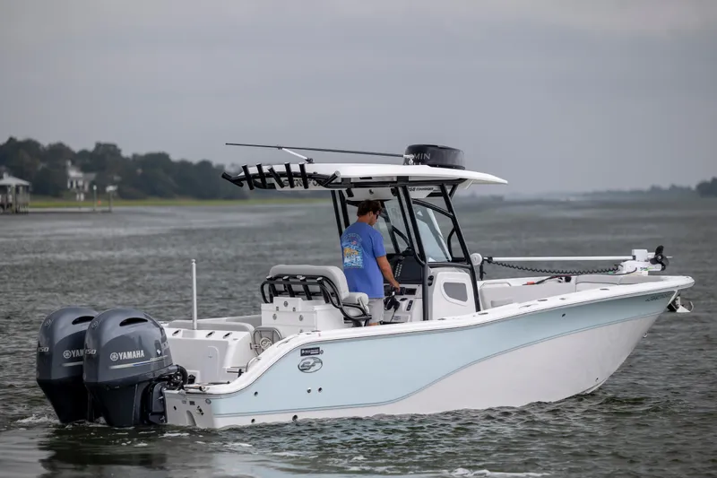 Slide: The Image of 2023 Sea Fox 268 Commander boat cruising on a calm waterway. - 5