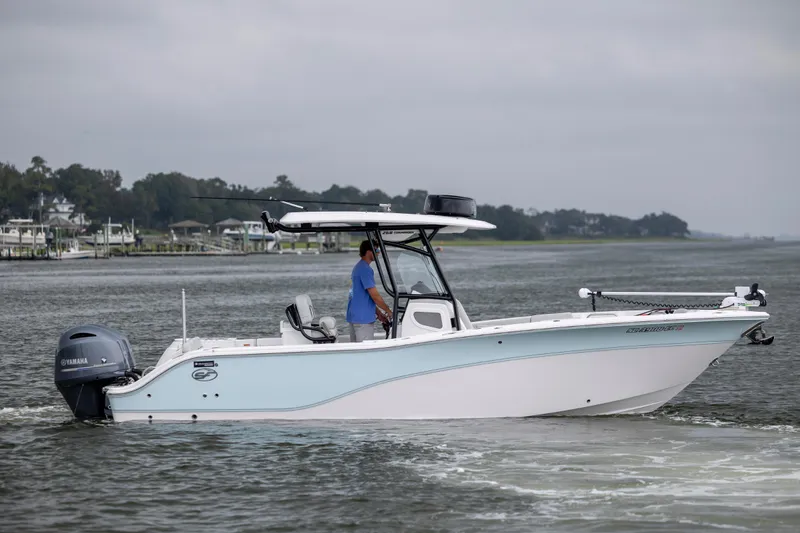 Slide: The Image of 2023 Sea Fox 268 Commander boat cruising on a calm waterway. - 6