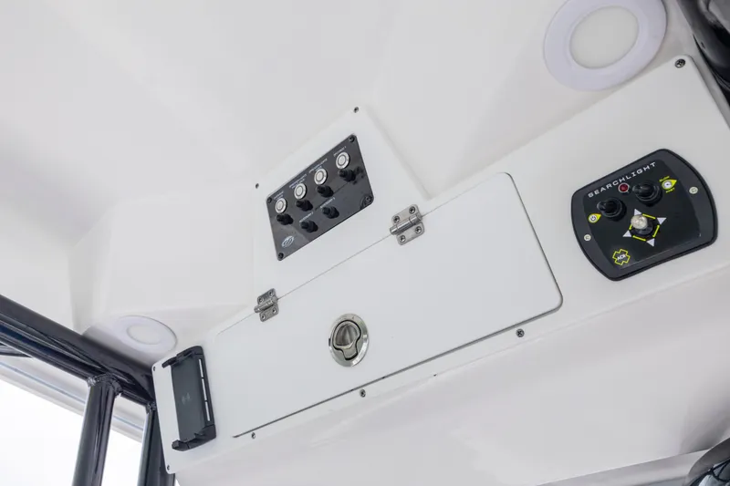 Slide: The Image of 2023 Sea Fox 268 Commander boat dashboard with control panel and searchlight controls. - 7