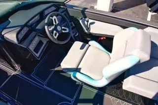 Slide: The Image of 2025 MasterCraft NXT23 boat interior with modern steering and comfortable seating. - 14