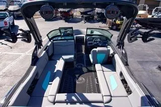 Slide: The Image of 2025 MasterCraft NXT23 boat interior with modern seating and dashboard design. - 8