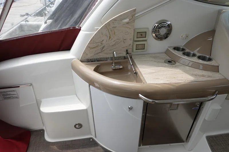 Slide: The Image of 2016 Formula 34 Cruiser yacht interior with sink, countertop, and cup holders. - 14