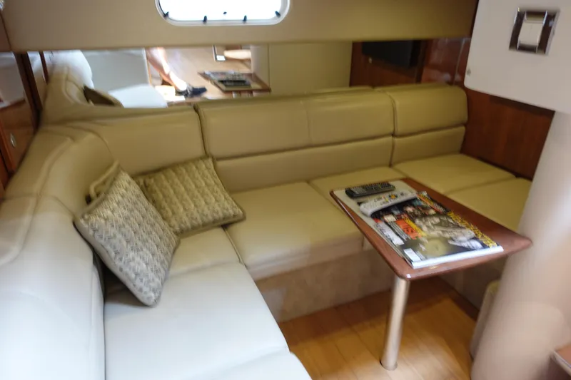 Slide: The Image of Interior of 2016 Formula 34 Cruiser with beige seating and wooden table. - 19