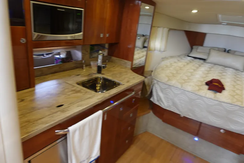 Slide: The Image of Interior of 2016 Formula 34 Cruiser with kitchenette and cozy sleeping area. - 21