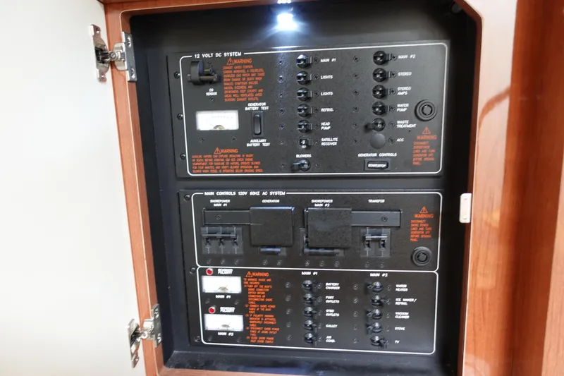 Slide: The Image of Control panel of a 2016 Formula 34 Cruiser boat, featuring electrical systems and switches. - 24