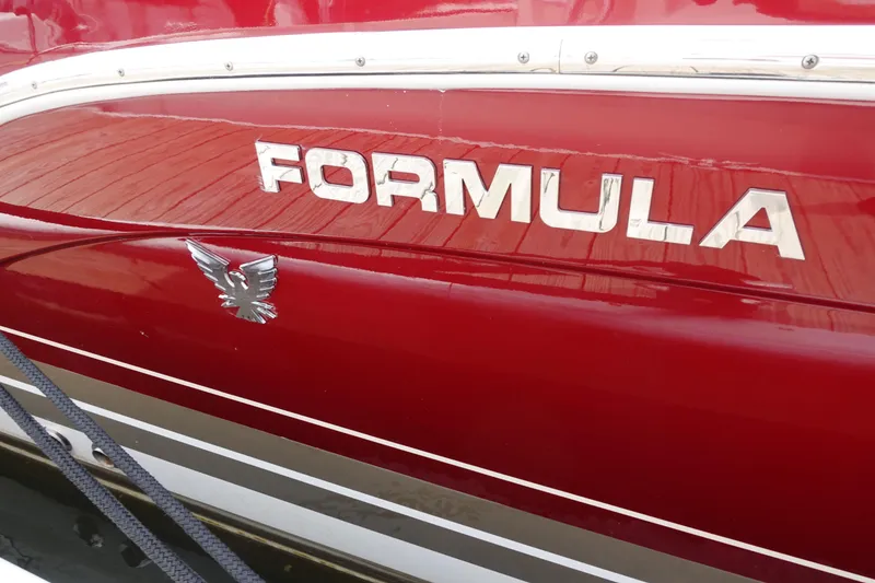 Slide: The Image of Red 2016 Formula 34 Cruiser boat with logo and eagle emblem. - 3