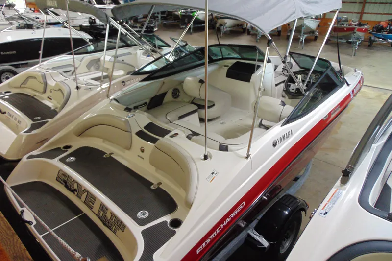 The Image of 2014 Yamaha SX192 boat with red stripe in interior view. - 1