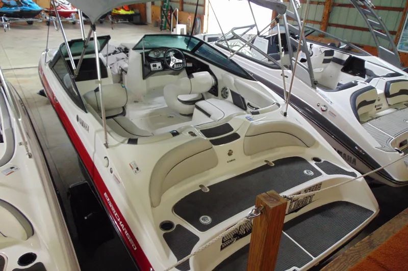 Slide: The Image of 2014 Yamaha SX192 boat in a storage facility. - 3