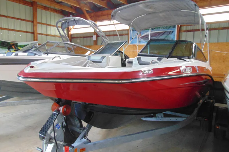 Slide: The Image of 2014 Yamaha SX192 boat in red color, stored indoors. - 4