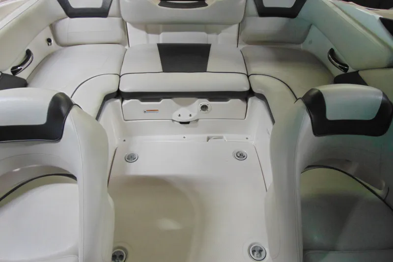Slide: The Image of Interior of a 2014 Yamaha SX192 boat with white seating. - 8