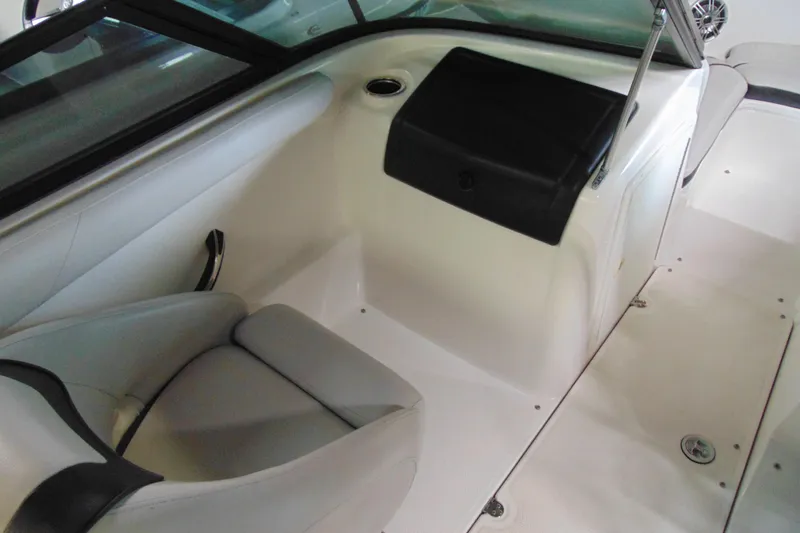 Slide: The Image of Interior of a 2014 Yamaha SX192 boat, seating area and dashboard. - 9