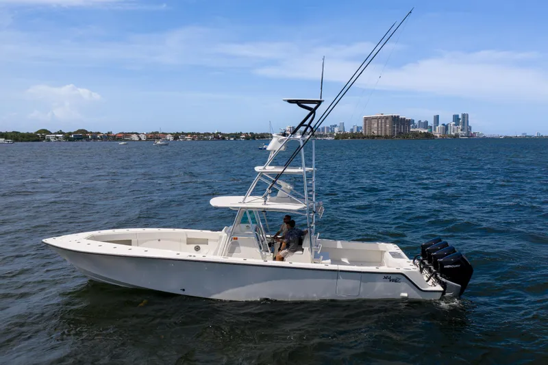 The Image of 2017 SeaVee 390 boat on water with city skyline in background. - 0
