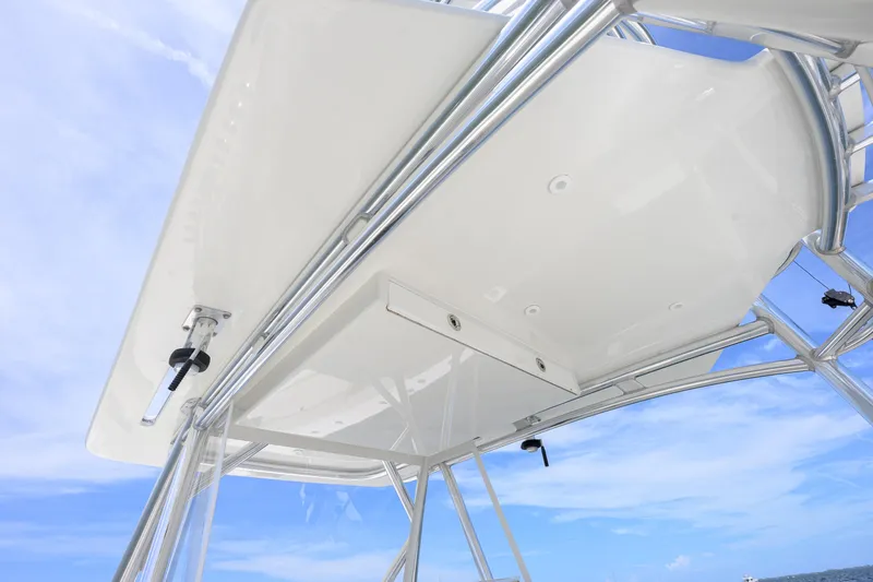 Slide: The Image of 2017 SeaVee 390 boat's sleek T-top design against a clear blue sky. - 3