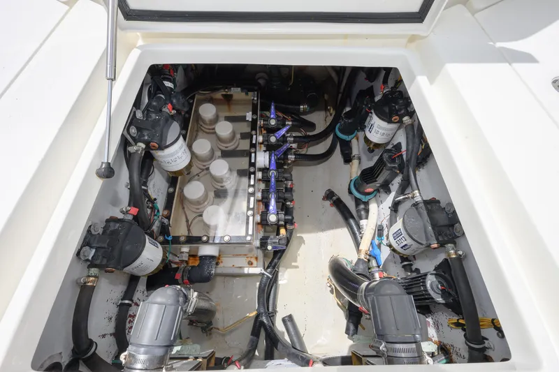 Slide: The Image of Engine compartment of 2017 SeaVee 390 boat, showcasing pumps and wiring. - 5