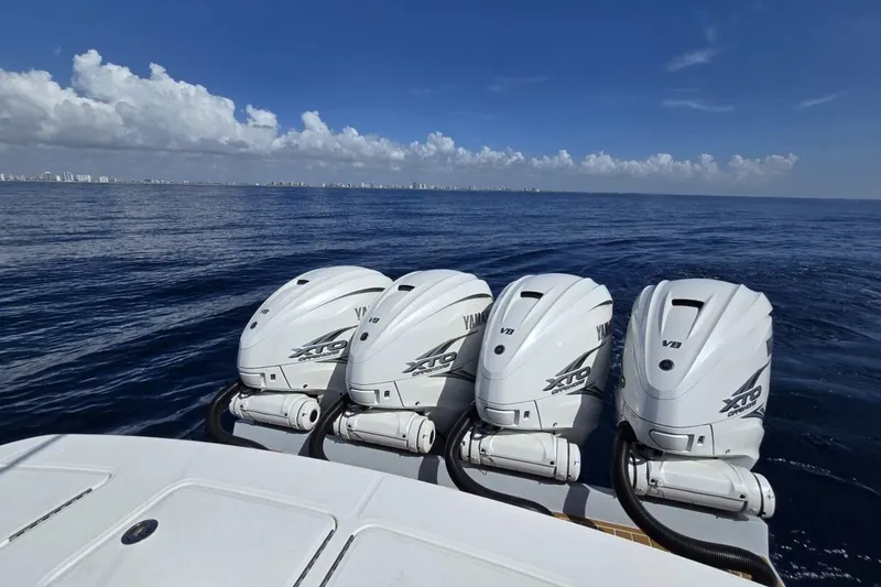 Slide: The Image of Four Yamaha XTO V8 engines on a 2020 Regulator motor yacht at sea. - 13
