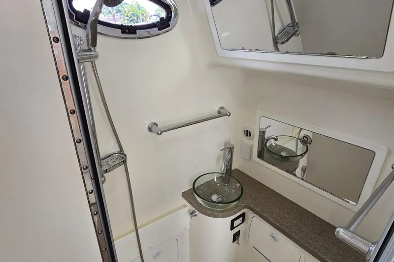 Slide: The Image of Luxurious 2020 Regulator Motor Yacht bathroom with modern fixtures and glass sink. - 17