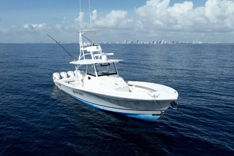 Slide: The Image of 2020 Regulator Motor Yacht on open sea with city skyline in background. - 21