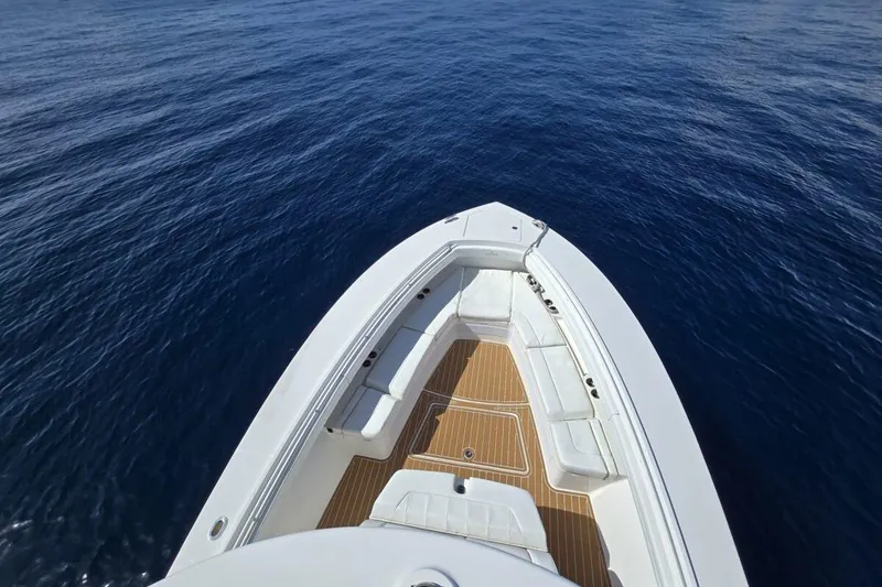 Slide: The Image of 2020 Regulator Motor Yacht bow view on calm ocean waters. - 8