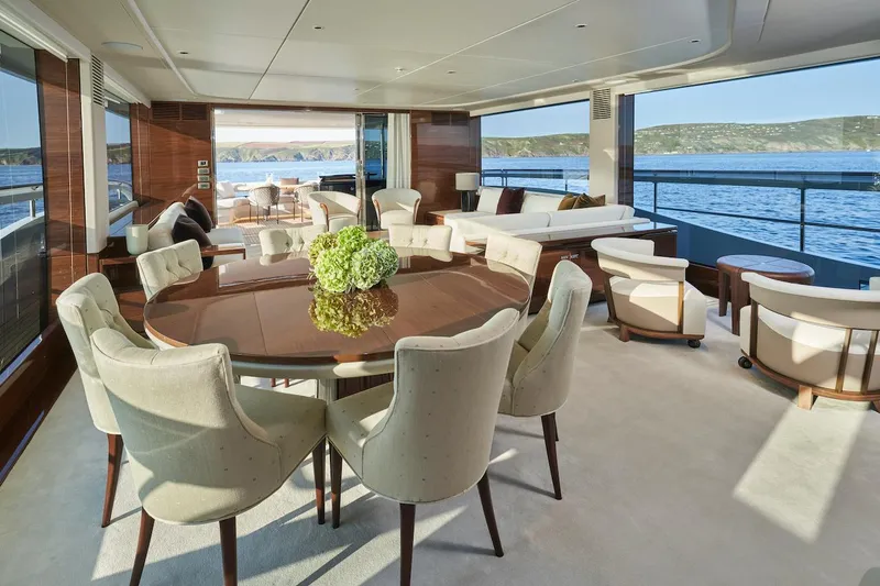 Slide: The Image of Luxurious interior of 2025 Princess X95 yacht with elegant dining area and ocean view. - 14