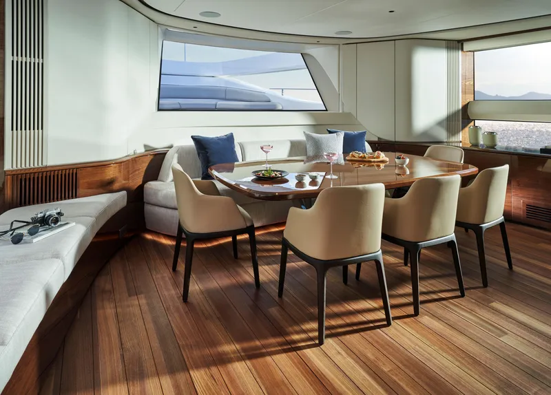 Slide: The Image of Luxurious dining area on 2025 Princess X95 yacht with elegant seating and wooden flooring. - 17