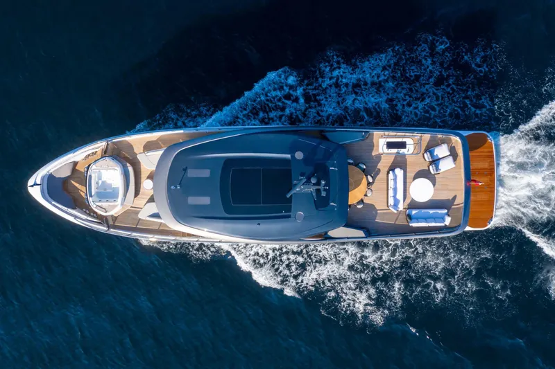 Slide: The Image of Aerial view of 2025 Princess X95 yacht cruising on open water. - 2
