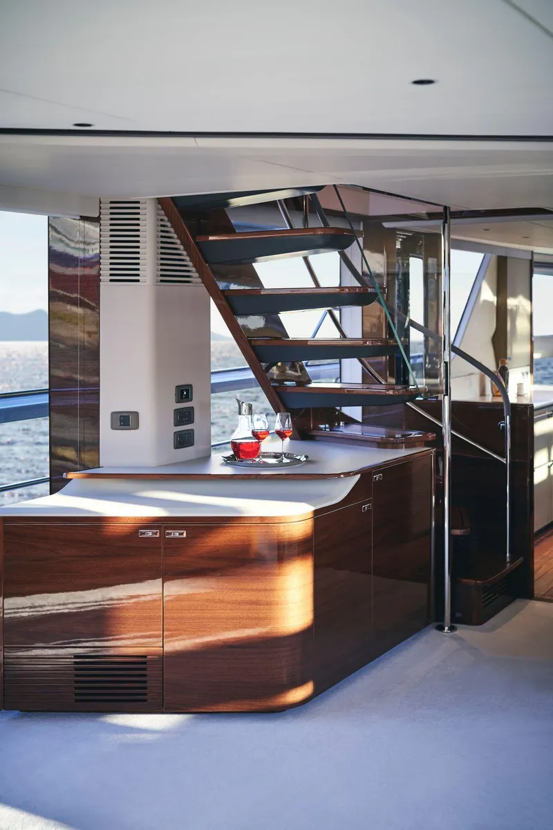 Slide: The Image of Luxurious interior of 2025 Princess X95 yacht with modern staircase and elegant design. - 26