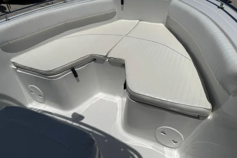 Slide: The Image of 2008 Sea Hunt 220 Triton boat interior with white cushioned seating. - 15