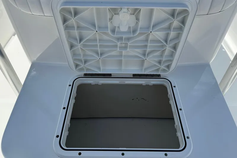 Slide: The Image of Open storage compartment on a 2008 Sea Hunt 220 Triton boat. - 17
