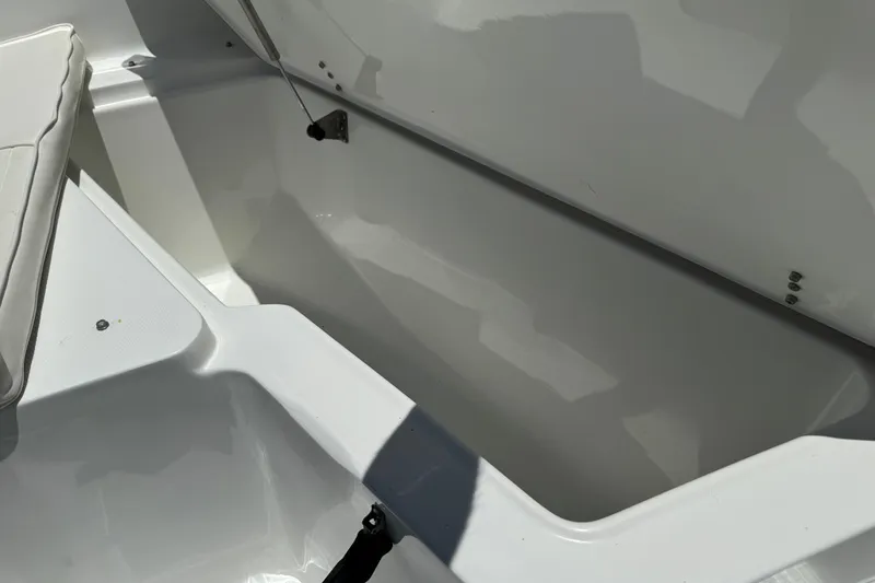 Slide: The Image of Open storage compartment on a 2008 Sea Hunt 220 Triton boat. - 18