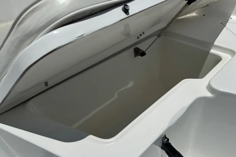 Slide: The Image of Open storage compartment on a 2008 Sea Hunt 220 Triton boat. - 19