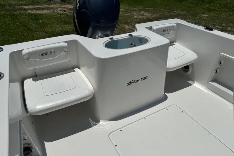 Slide: The Image of 2008 Sea Hunt 220 Triton boat interior with seating and storage compartments. - 2