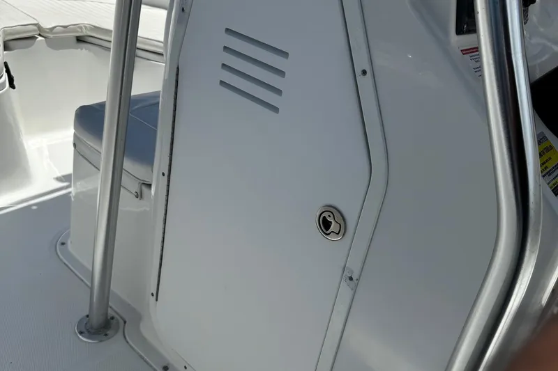 Slide: The Image of 2008 Sea Hunt 220 Triton boat interior with seating and storage compartment. - 23