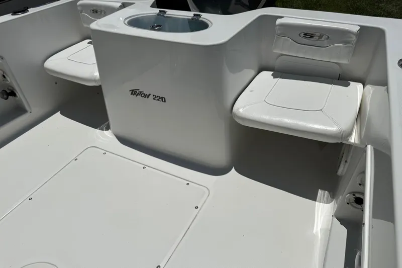 Slide: The Image of 2008 Sea Hunt 220 Triton boat interior with seating and storage compartments. - 3