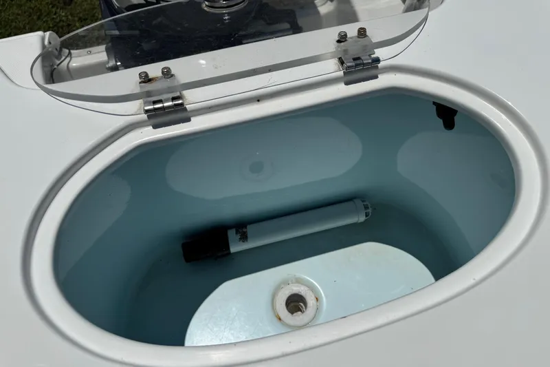 Slide: The Image of Open livewell on 2008 Sea Hunt 220 Triton boat, showing interior and plumbing. - 6