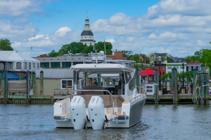 Slide: The Image of Nimbus W11 #46 boat docked in scenic harbor, 2025 model. - 11