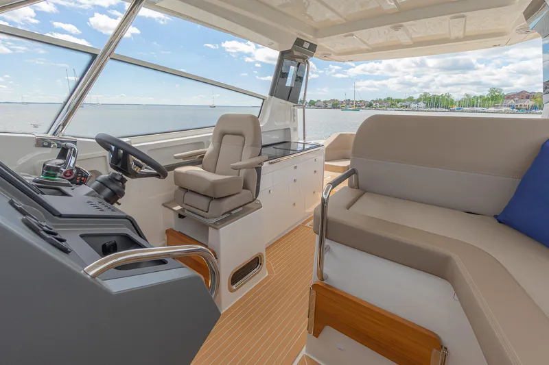 Slide: The Image of Luxurious interior of 2025 Nimbus W11 #46 yacht with modern seating and steering area. - 14