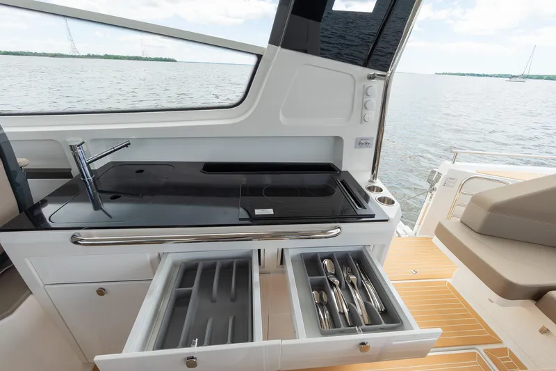 Slide: The Image of Modern kitchen area on Nimbus W11 #46 yacht, featuring sleek design and open drawers, 2025 model. - 24