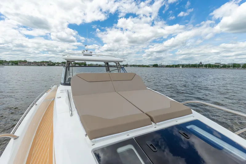 Slide: The Image of Luxurious Nimbus W11 #46 yacht with sun loungers on a serene lake, 2025 model. - 25