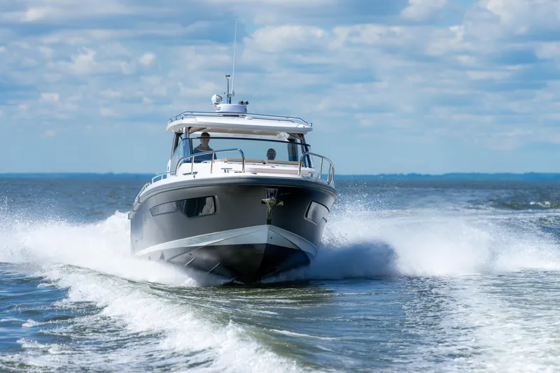 Slide: The Image of Nimbus W11 #46 boat cruising on open water, 2025 model. - 26