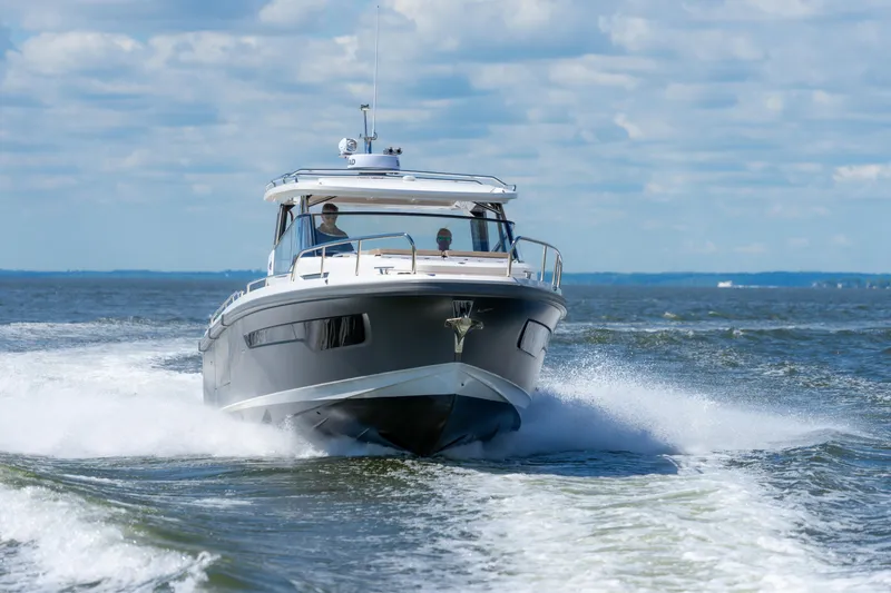 Slide: The Image of Nimbus W11 #46 boat cruising on open water, 2025 model. - 27